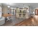 Spacious open concept kitchen with tile floors, granite counters, bar, and stainless appliances at 47997 Wagoner Rd, Richfield, NC 28137