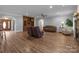 Open concept living room boasts a fireplace, hardwood floors, and large windows at 47997 Wagoner Rd, Richfield, NC 28137