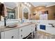 Elegant bathroom featuring double sinks, chandelier lighting, and a luxurious soaking tub for relaxation at 515 Brawley Rd, Cleveland, NC 27013