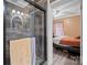 Modern bathroom featuring a glass-enclosed shower and a view into the adjacent bedroom for added openness at 515 Brawley Rd, Cleveland, NC 27013