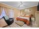 Comfortable bedroom with ample natural light, ceiling fan, and neutral tones for a relaxing retreat at 515 Brawley Rd, Cleveland, NC 27013