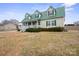 Charming two-story home with green metal roof and inviting front porch at 515 Brawley Rd, Cleveland, NC 27013