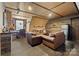 Comfortable living room showcasing unique ceiling design, wood accent wall, and plush seating at 515 Brawley Rd, Cleveland, NC 27013