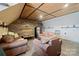 Inviting living room with exposed ceiling beams, wood paneling, and cozy, comfortable seating at 515 Brawley Rd, Cleveland, NC 27013