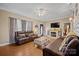 Cozy living room featuring leather furniture, a fireplace, and hardwood floors at 515 Brawley Rd, Cleveland, NC 27013