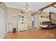 Spacious living room featuring exposed wood beams, hardwood floors, and a cozy, inviting atmosphere at 515 Brawley Rd, Cleveland, NC 27013