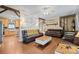 Cozy living room featuring leather furniture, a fireplace, and hardwood floors at 515 Brawley Rd, Cleveland, NC 27013