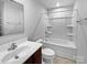 Clean bathroom with a white bathtub, a sink, and a toilet at 6324 Cutwater Cir, Charlotte, NC 28269