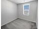 Simple bedroom with single window and neutral decor at 6324 Cutwater Cir, Charlotte, NC 28269