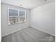 Well-lit bedroom featuring neutral walls and carpet at 6324 Cutwater Cir, Charlotte, NC 28269