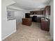 Modern kitchen featuring dark brown cabinetry and an island at 6324 Cutwater Cir, Charlotte, NC 28269