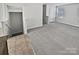 Large living area with neutral carpeting and staircase at 6324 Cutwater Cir, Charlotte, NC 28269