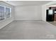 Bright living room with neutral walls and gray carpeting at 6324 Cutwater Cir, Charlotte, NC 28269