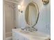 Cozy bathroom featuring a shower-tub combo, vanity with custom mirror and a toilet at 641 Museum Dr, Charlotte, NC 28207