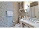 Charming bathroom with designer wallpaper, marble vanity, and stylish fixtures at 641 Museum Dr, Charlotte, NC 28207