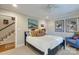 Bright bedroom with ceiling fan, comfortable bed and an open doorway at 641 Museum Dr, Charlotte, NC 28207
