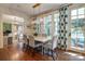 Dining area with modern chandelier, large windows, and hardwood flooring at 641 Museum Dr, Charlotte, NC 28207