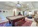 Large game room featuring a billiard table, media area, and comfortable seating at 641 Museum Dr, Charlotte, NC 28207