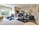 Well-equipped home gym featuring a weight bench, free weights and a treadmill at 641 Museum Dr, Charlotte, NC 28207