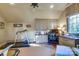 Bright home office featuring built-in cabinetry, a treadmill, and a large window at 641 Museum Dr, Charlotte, NC 28207