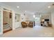 Comfortable living room featuring two chairs, a desk and staircase to a second floor at 641 Museum Dr, Charlotte, NC 28207