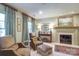 Cozy living room featuring a fireplace, comfortable seating, and elegant decor at 641 Museum Dr, Charlotte, NC 28207