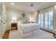 Spacious main bedroom with ceiling fan, light-filled windows, and neutral decor at 641 Museum Dr, Charlotte, NC 28207