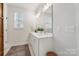 Bright bathroom showcasing a modern vanity, ample lighting, and tasteful decor at 7020 Loso Commons Way, Charlotte, NC 28217