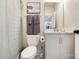 Bathroom with toilet, vanity and marble counter, and neutral color scheme at 7020 Loso Commons Way, Charlotte, NC 28217