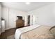 Cozy bedroom with natural light, wooden floors, and a tranquil view at 7020 Loso Commons Way, Charlotte, NC 28217