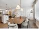 Dining area with modern lighting, table, and chairs at 7020 Loso Commons Way, Charlotte, NC 28217