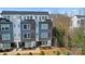 Modern townhome featuring a rooftop deck, and sleek exterior at 7020 Loso Commons Way, Charlotte, NC 28217