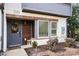 Charming front entry with a wreath and warm wood accents at 7020 Loso Commons Way, Charlotte, NC 28217