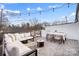Relaxing rooftop deck with outdoor seating, string lights and neighborhood views at 7020 Loso Commons Way, Charlotte, NC 28217