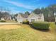 Lovely exterior view showcasing manicured landscaping and a neatly kept lawn surrounding the home at 7021 Merrymount Ct, Concord, NC 28025