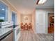 Cozy dining area with luxury vinyl plank flooring, natural light, and a view from the kitchen at 706 W 19Th Ave, Gastonia, NC 28052