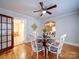 Charming dining room with hardwood floors, glass table, and access to other rooms at 706 W 19Th Ave, Gastonia, NC 28052