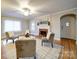 Bright living room features hardwood floors, fireplace, stylish seating and an arched doorway at 706 W 19Th Ave, Gastonia, NC 28052