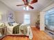 Comfortable main bedroom featuring hardwood floors, a ceiling fan, and a stylish decor at 706 W 19Th Ave, Gastonia, NC 28052