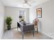 Inviting bedroom with neutral tones, a well-lit desk area, and a comfortable chair creates an ideal workspace at 7719 Abigail Glen Dr, Charlotte, NC 28212