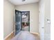 Entry foyer showcasing wood-look floors and an exterior view through the front door at 7719 Abigail Glen Dr, Charlotte, NC 28212
