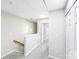 Bright hallway with neutral walls, plush gray carpet, and closet space at 7719 Abigail Glen Dr, Charlotte, NC 28212