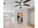 Spacious living room showcasing wood-look floors, a ceiling fan, and an arched entryway at 7719 Abigail Glen Dr, Charlotte, NC 28212