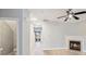 Open-concept living room featuring wood-look floors, a fireplace, and recessed lighting at 7719 Abigail Glen Dr, Charlotte, NC 28212