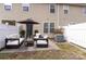 Outdoor patio with stylish seating under an umbrella, creating an inviting space for relaxation and entertainment at 7719 Abigail Glen Dr, Charlotte, NC 28212