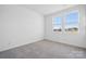 Bright bedroom featuring neutral carpeting and large windows at 821 Hallman Branch Ln, Lincolnton, NC 28092