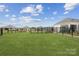 Fully fenced community dog park with a grassy area and bench for pet owners at 821 Hallman Branch Ln, Lincolnton, NC 28092