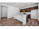 Modern kitchen with an island and dark brown cabinets at 821 Hallman Branch Ln, Lincolnton, NC 28092