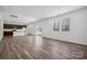 Open concept kitchen with island, dark cabinetry, and stainless steel appliances at 821 Hallman Branch Ln, Lincolnton, NC 28092