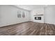 Bright living room featuring hardwood floors and a modern fireplace at 821 Hallman Branch Ln, Lincolnton, NC 28092